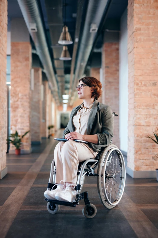 a woman in a wheelchair in an office hallway, a portrait, pexels, renaissance, pastel', rectangle, fall season, long