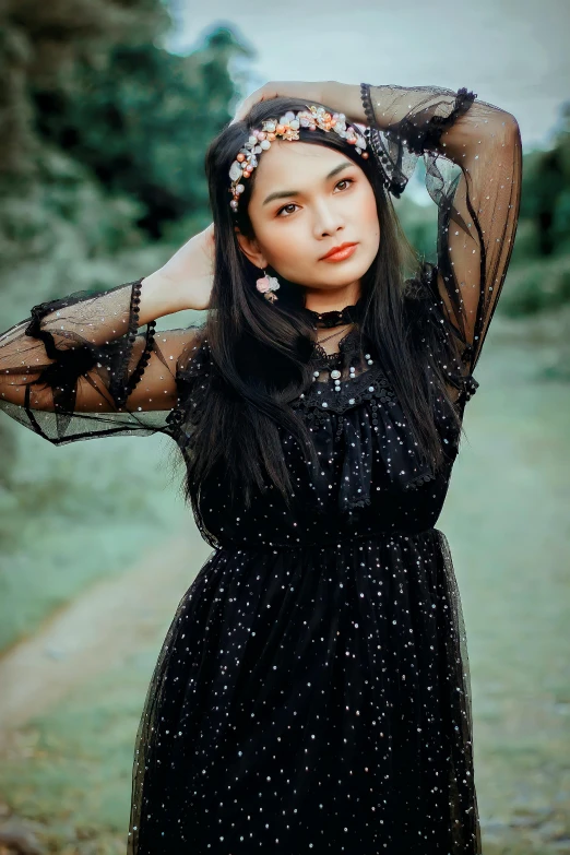 a woman in a black dress posing for a picture, inspired by reyna rochin, pexels contest winner, wearing a dress made of stars, asian girl, lovely bohemian princess, lookbook