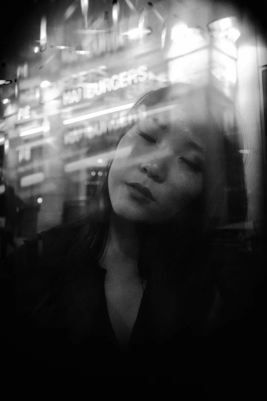 a black and white photo of a woman with her eyes closed, a black and white photo, inspired by Jung Park, watching night streets, yuli ban, medium format, ((portrait))