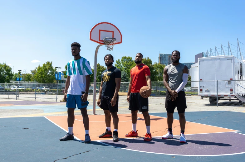 a group of men standing on top of a basketball court, inspired by Paul Georges, trending on dribble, looking to the side off camera, profile image, on a bright day, game pack