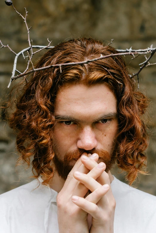 a man with a crown of thorns on his head, an album cover, inspired by William Dobson, trending on pexels, ginger wavy hair, pensive, aphex twin, style of seb mckinnon