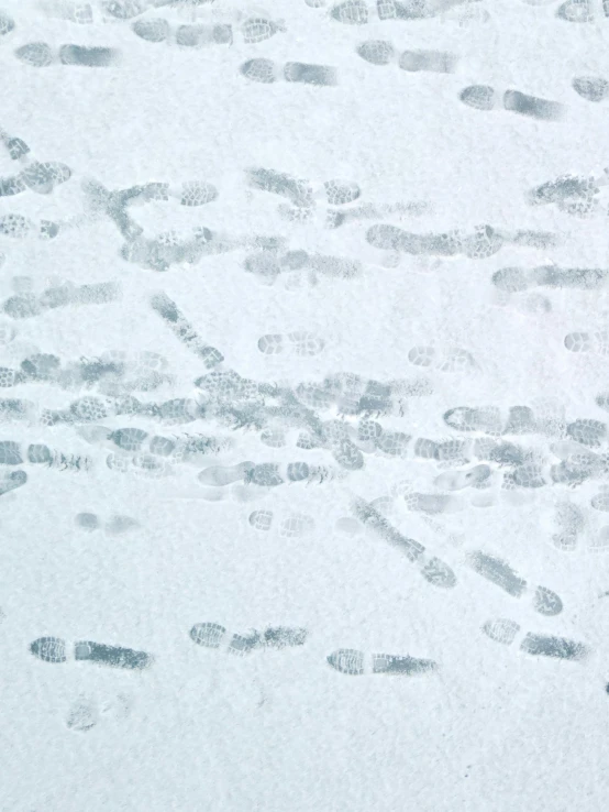 a man riding a snowboard down a snow covered slope, a microscopic photo, inspired by Vija Celmins, trending on reddit, thumbprint, detail shot, dna experiment, background image