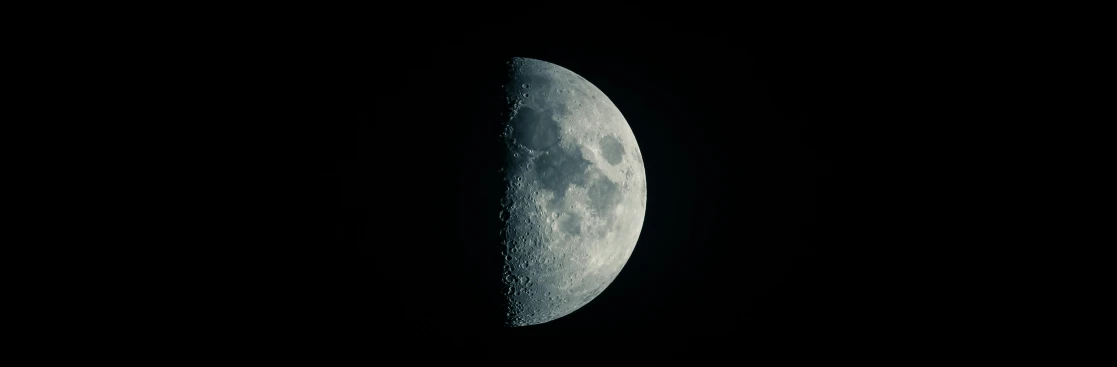a half moon is seen in the dark sky, an album cover, by Adam Marczyński, pexels, minimalism, moon craters, ☁🌪🌙👩🏾, high detail 4 k, hd footage