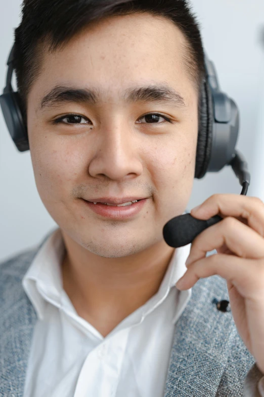 a close up of a person wearing a headset, by Francis Helps, asian man, background image, hans, high resolution image