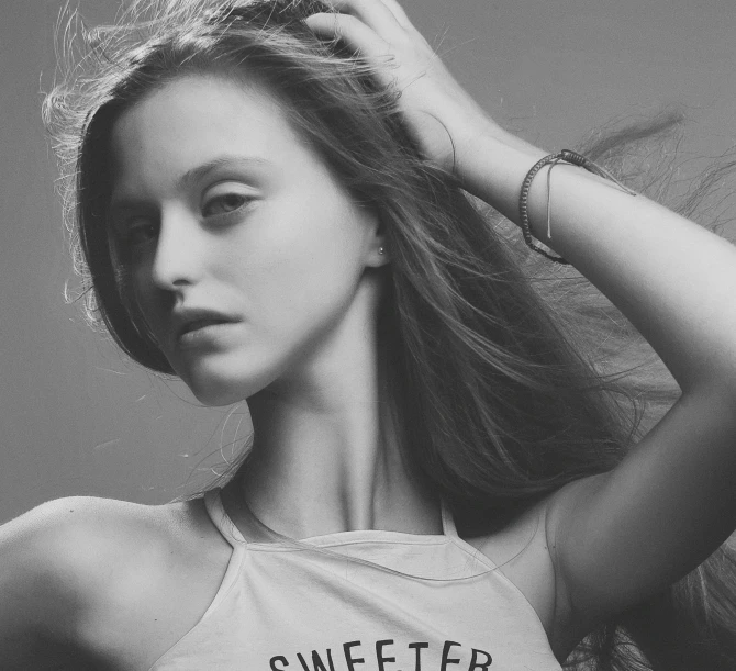 a black and white photo of a woman with long hair, by Emma Andijewska, tumblr, sweets, wearing tanktop, promotional image, # nofilter