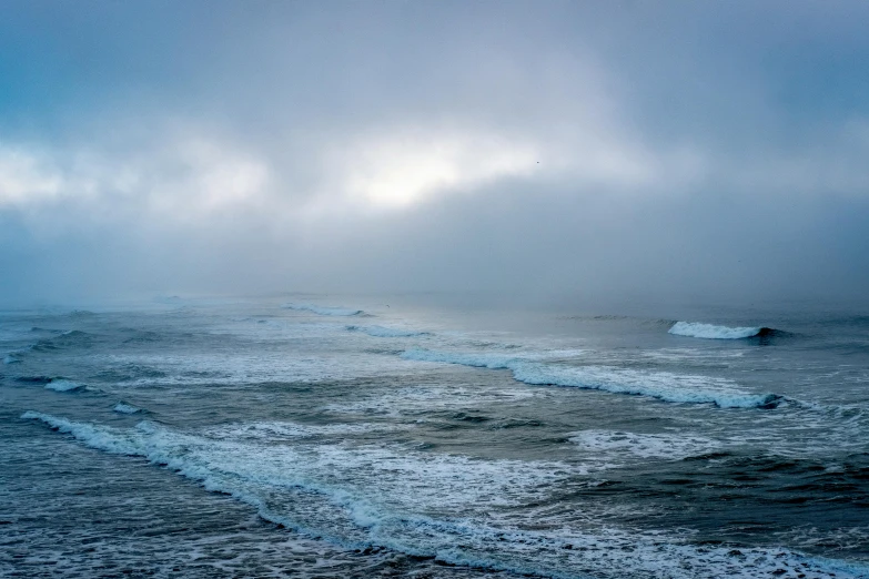 a view of the ocean on a foggy day, inspired by Elsa Bleda, pexels contest winner, blue gray, sea foam, blue, slide show