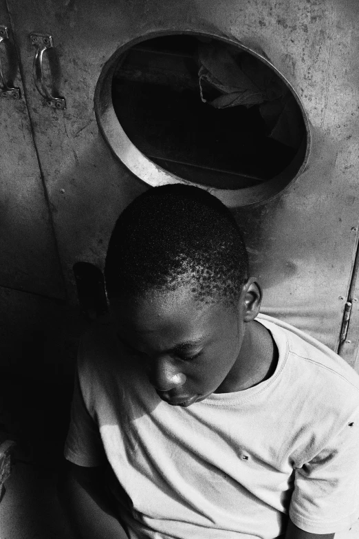 a black and white photo of a boy sitting on a toilet, by Albert Welti, visual art, emmanuel shiru, asleep, 1999 photograph, ( ( photograph ) )