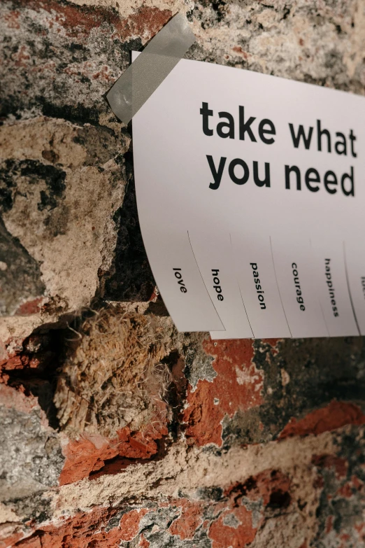 a piece of paper attached to a brick wall, a poster, by Niko Henrichon, unsplash, jar on a shelf, acronym, take, tattered