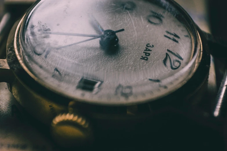 a close up of a watch on a table, pexels contest winner, grainy vintage, crystalized time warps, thumbnail, background image