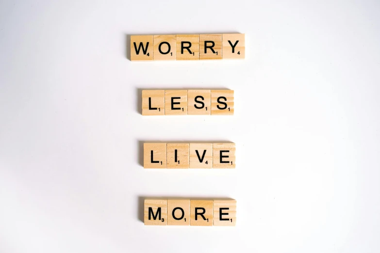 scrabbles spelling worry less live more, a picture, pexels, minimalism, ptsd, cottagecore hippie, perfectly tileable, 🦩🪐🐞👩🏻🦳