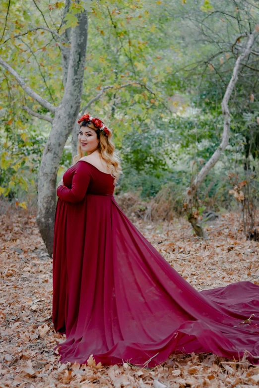 a woman in a red dress standing in the woods, by Robbie Trevino, baroque, pregnancy, crown and gown, plus size, long sleeves