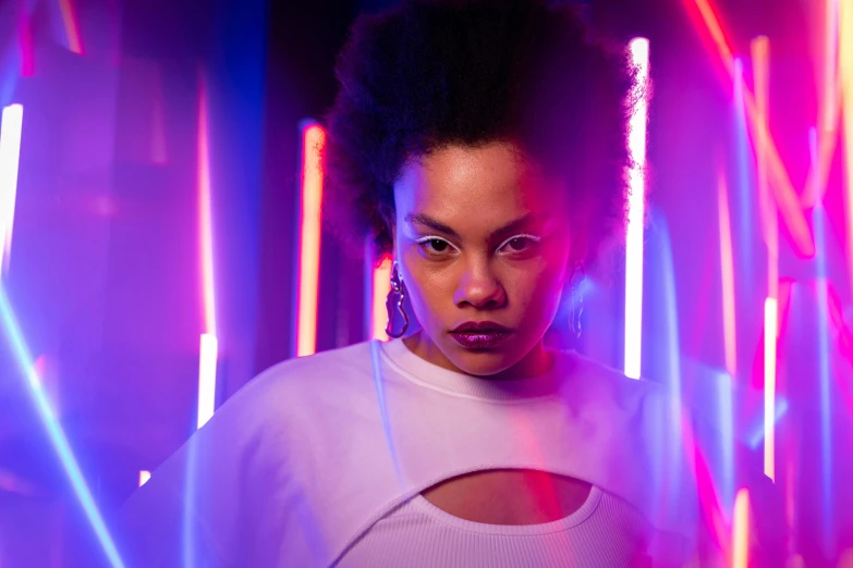 a woman standing in front of neon lights, a portrait, pexels contest winner, afrofuturism, tessa thompson inspired, studio lighting”, woman in streetwear, medium portrait top light