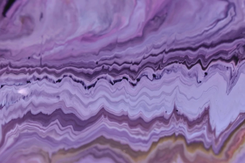 a close up of a piece of purple marble, inspired by Violet Oakley, trending on unsplash, analytical art, slightly pixelated, looking happy, multiple layers, purple tornado