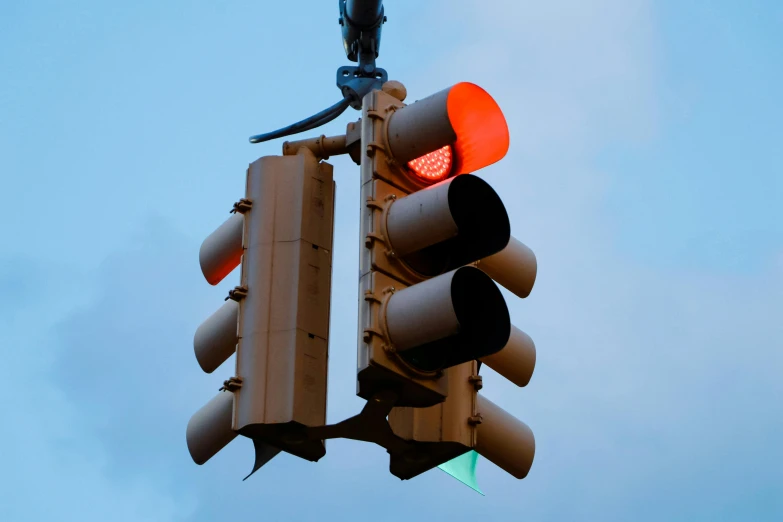 a close up of a traffic light with a sky background, an album cover, unsplash, bauhaus, volumetric lighting. red, ignant, police lights, brown