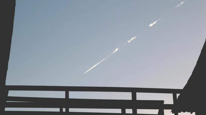 a plane that is flying in the sky, by Niko Henrichon, postminimalism, guardrail, meteor, afternoon, fumes