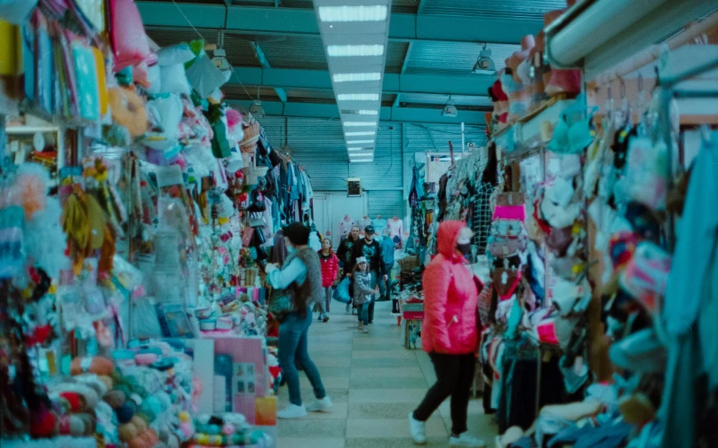 a group of people walking through a store, trending on unsplash, maximalism, still from the film, market stalls, thumbnail, blueish
