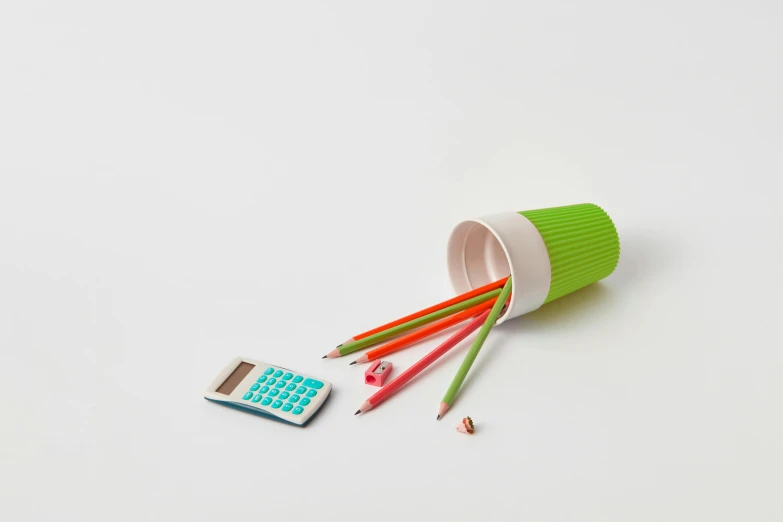 a cup filled with pencils and a calculator, by jeonseok lee, plasticien, cyan and green, high quality product photo, multicolor, small