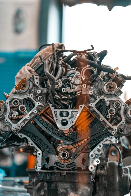 a close up of a car engine on display, pexels contest winner, assemblage, close-up of a robot sitting down, inspect in inventory image, symmetrical mechanical features, looking partly to the left