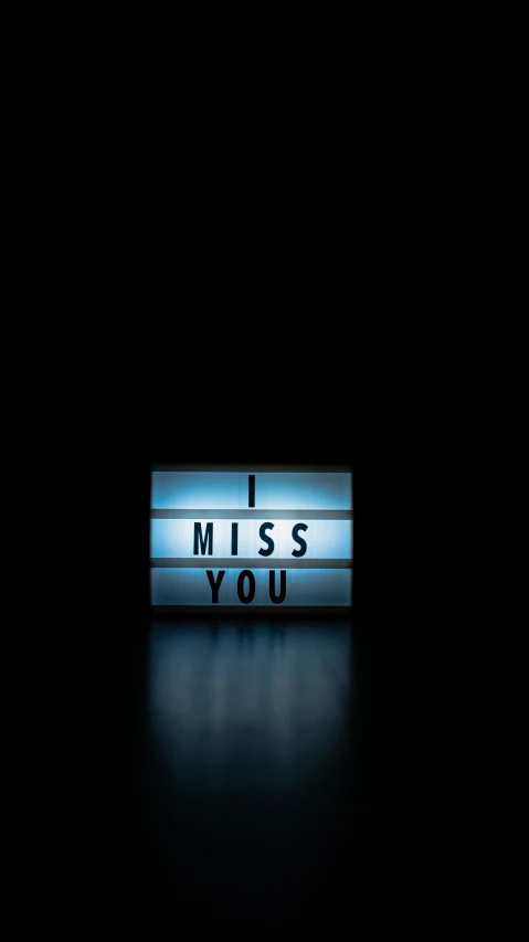 a light up sign that says i miss you, minimalism, high-quality photo, thumbnail, lightbox, dark. no text