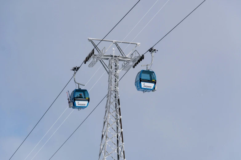 a couple of gondolas sitting on top of a pole, electric blue, opposite the lift-shaft, avatar image, grey