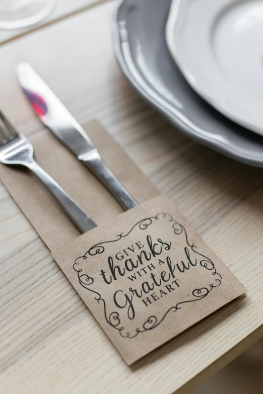 a close up of a plate with a fork and knife, instagram, folk art, thank you, paper decoration, product label, holiday