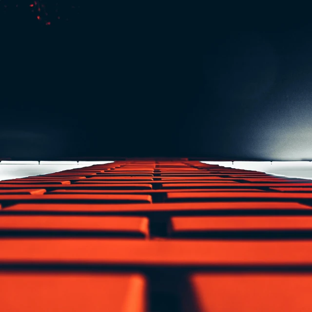 a row of red boxes sitting on top of a floor, by Daniel Lieske, pexels contest winner, digital art, stairway to heaven, dark orange black white red, bright macro view pixar, an abstract