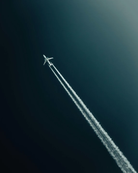 an airplane that is flying in the sky, by Matthias Weischer, pexels contest winner, conceptual art, chemistry, head straight down, low key, atsmospheric