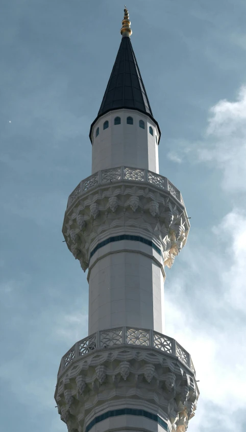 a tall tower with a clock on top of it, inspired by Abdullah Gërguri, hurufiyya, rounded roof, white, in 1 9 9 5, spire