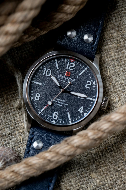 a close up of a watch with a rope, a portrait, reddit, rugged textured face, thumbnail, black draconic - leather, panorama