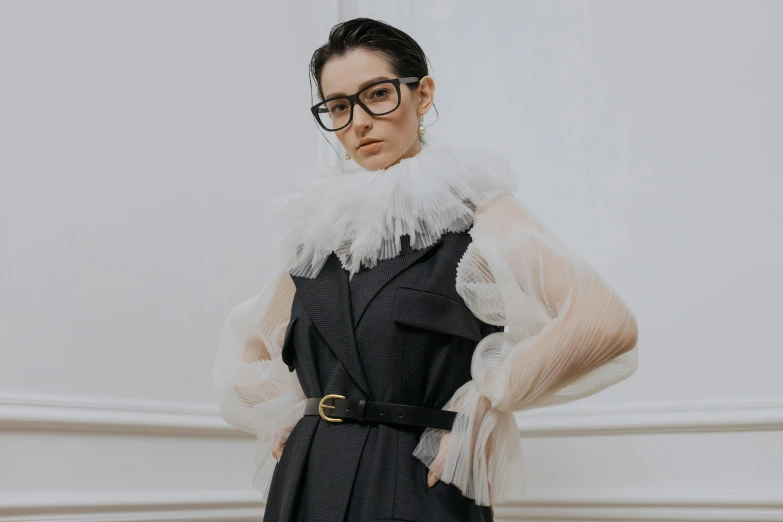 a woman wearing glasses and a black dress, inspired by Marie-Gabrielle Capet, trending on pexels, baroque, off - white collection, fluffy neck, androgyny, dress in voile