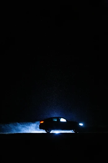 a car driving down a road at night, by Adam Chmielowski, pexels contest winner, conceptual art, cold blue light, black silhouette, high-key lightning, dramatic lighting - n 9