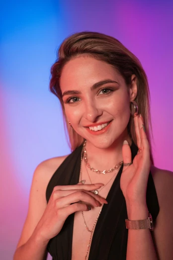 a woman in a black dress posing for a picture, a colorized photo, by Julia Pishtar, trending on pexels, jewelry lighting, twitch streamer, soft lighting 8k, smiling young woman