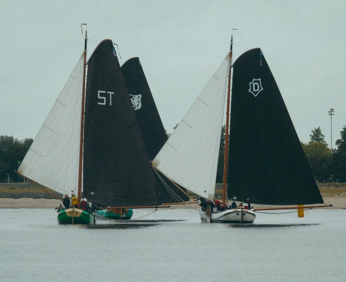 a couple of boats that are in the water, by Simon Marmion, unsplash, renaissance, race footage, with screens and silks, ignant, swanland