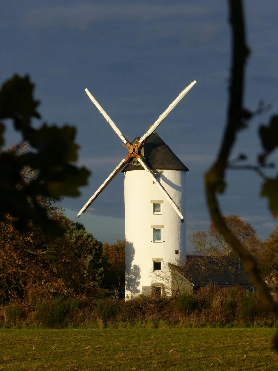 a white windmill sitting on top of a lush green field, autumn colours, award - winning crisp details ”, exterior, sail