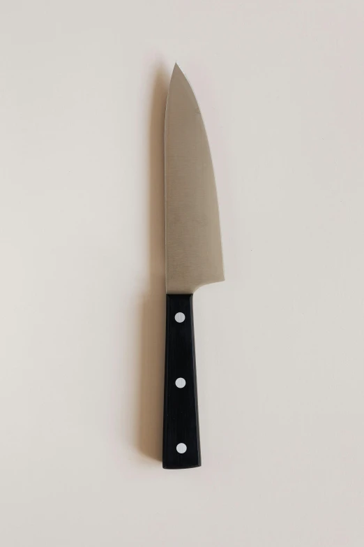 a close up of a knife on a white surface, by Doug Ohlson, fan favorite, marin kitagawa, 王琛, vine