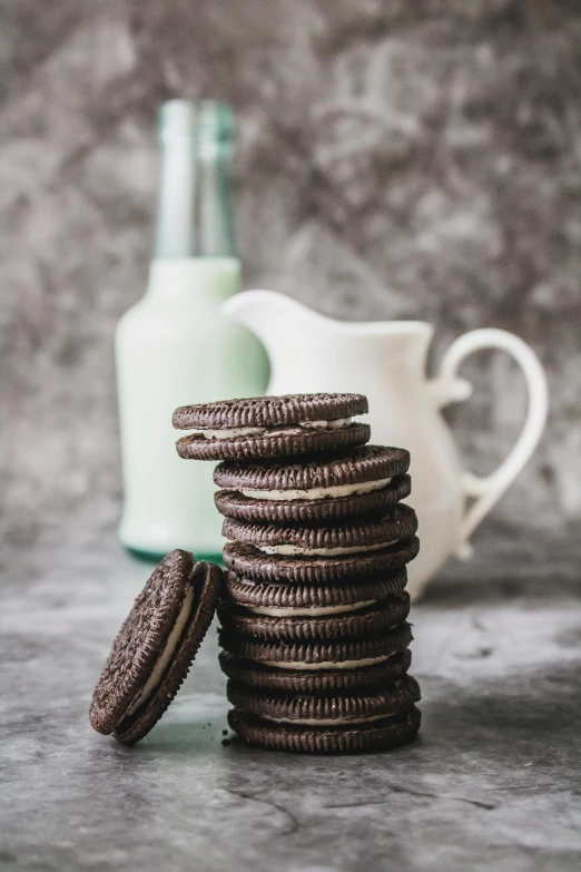 a stack of cookies next to a bottle of milk, by Ben Zoeller, pexels contest winner, grey, mint, 5k, chocolate