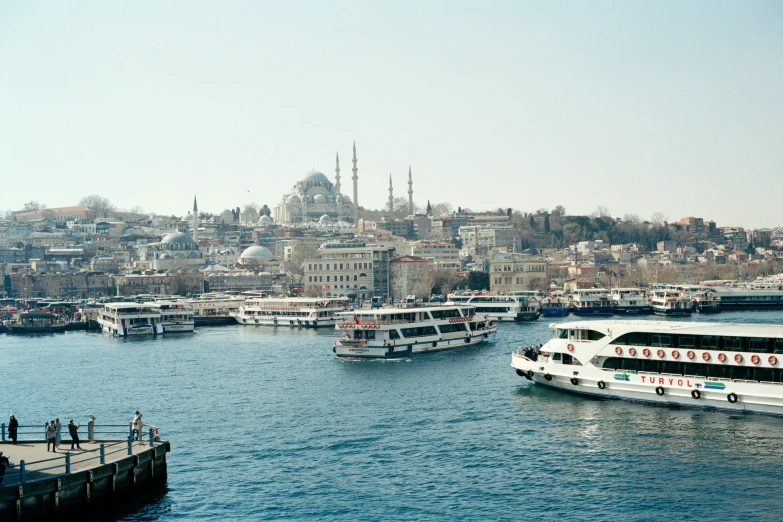 a large body of water filled with lots of boats, a colorized photo, pexels contest winner, hurufiyya, istanbul, medium format, grayish, 2000s photo