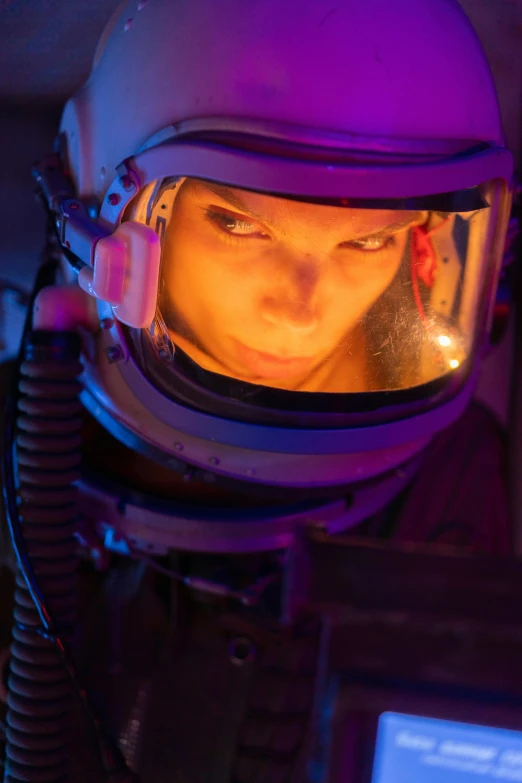a close up of a person in a space suit, a portrait, flickr, red and cinematic lighting, dafne keen, museum quality photo, luminous cockpit