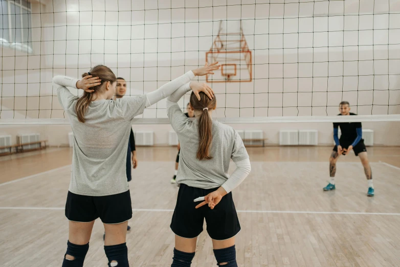 a group of young women playing a game of volleyball, unsplash contest winner, danube school, background image, indoor picture, profile image, thumbnail