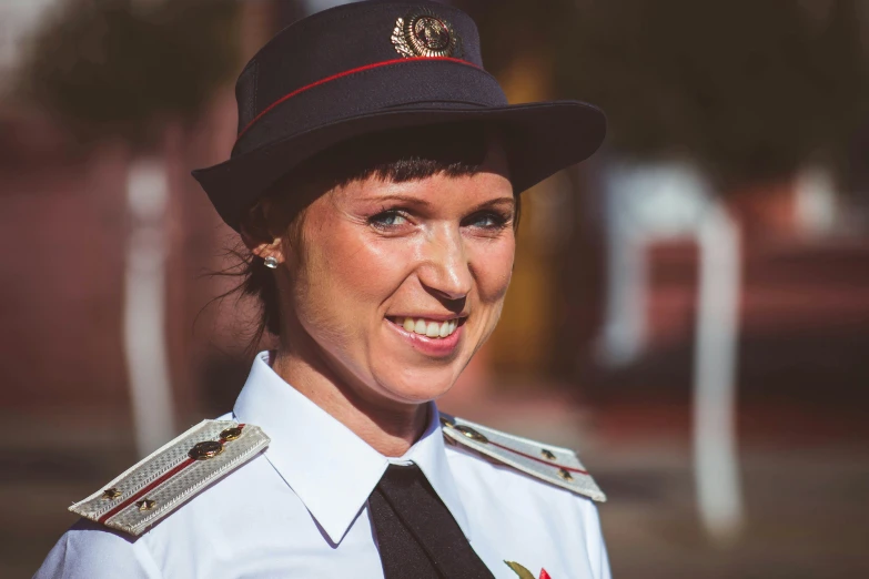 a woman in a uniform smiles at the camera, by Julia Pishtar, pexels contest winner, russian, avatar image, lachlan bailey, profile image