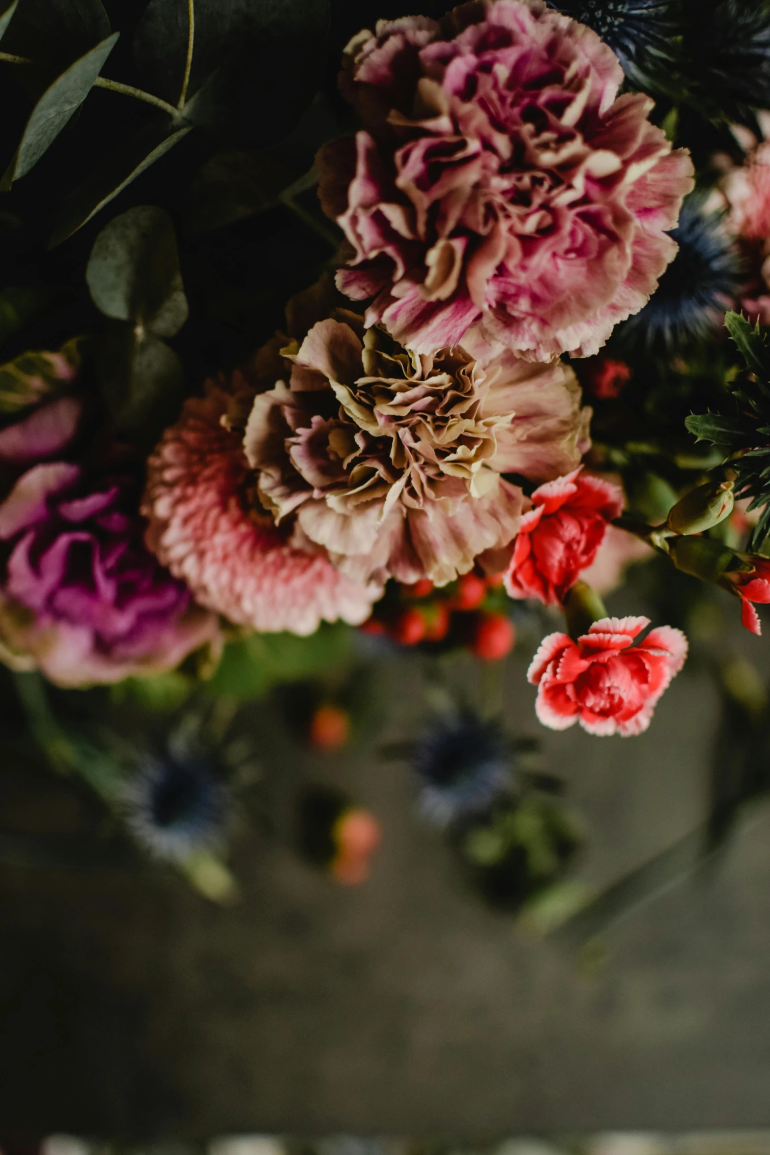 a bouquet of flowers sitting on top of a table, by Elsie Few, trending on unsplash, baroque, made of flowers and berries, carnation, detail shot, textural