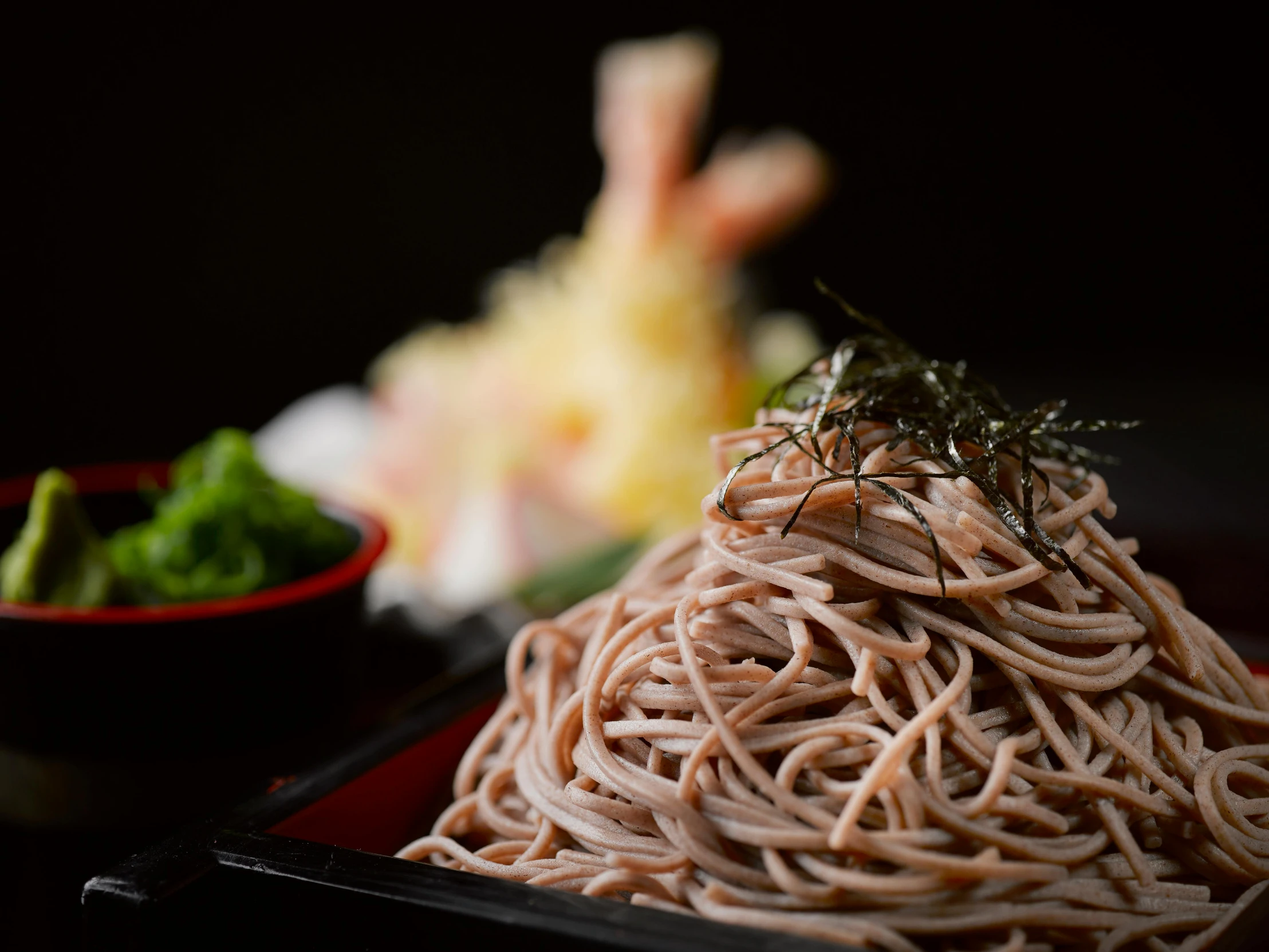 a black plate topped with noodles next to a bowl of broccoli, unsplash, sōsaku hanga, flowing sakura silk, medium close up, made of spaghetti, 15081959 21121991 01012000 4k