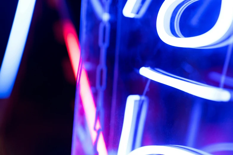 a close up of a neon sign on a building, blue light saber, lava lamp, shot with sony alpha, laser light *