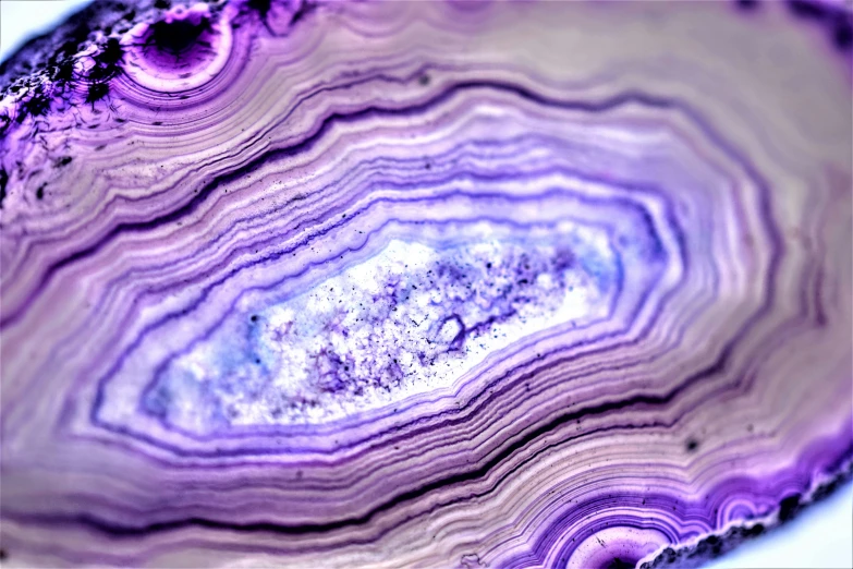 a close up of a slice of purple marble, a microscopic photo, by Jan Rustem, pexels, baroque, bismuth beautiful well designed, blue lights and purple lights, limestone, ((purple))