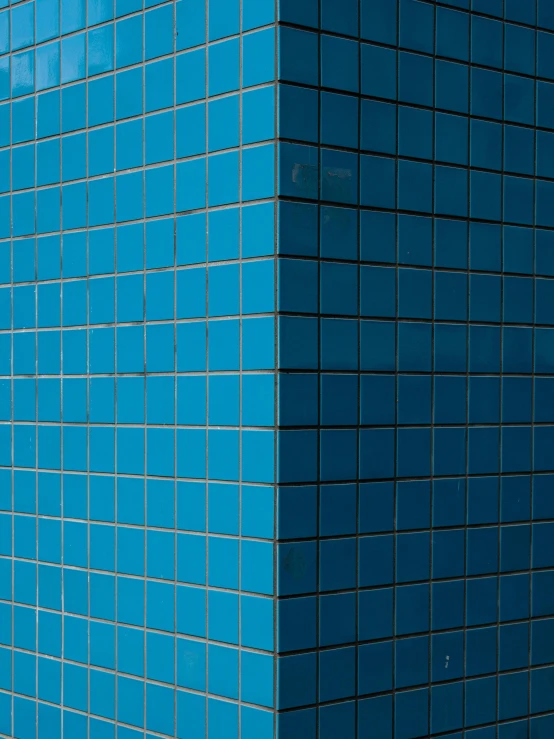 a fire hydrant in front of a blue tiled wall, inspired by Andreas Gursky, são paulo, window ( city ), 3 d metallic ceramic, wall corner
