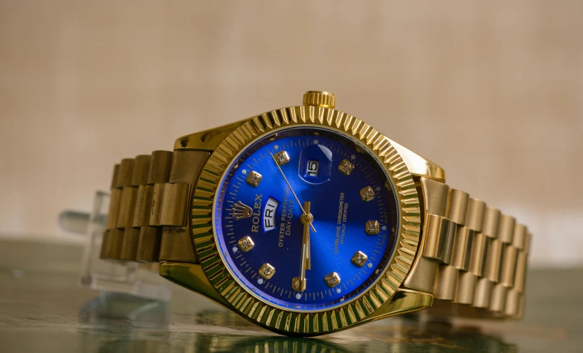 a close up of a watch on a table, pexels contest winner, renaissance, golden blue outfit, chief keef, thumbnail, replicas