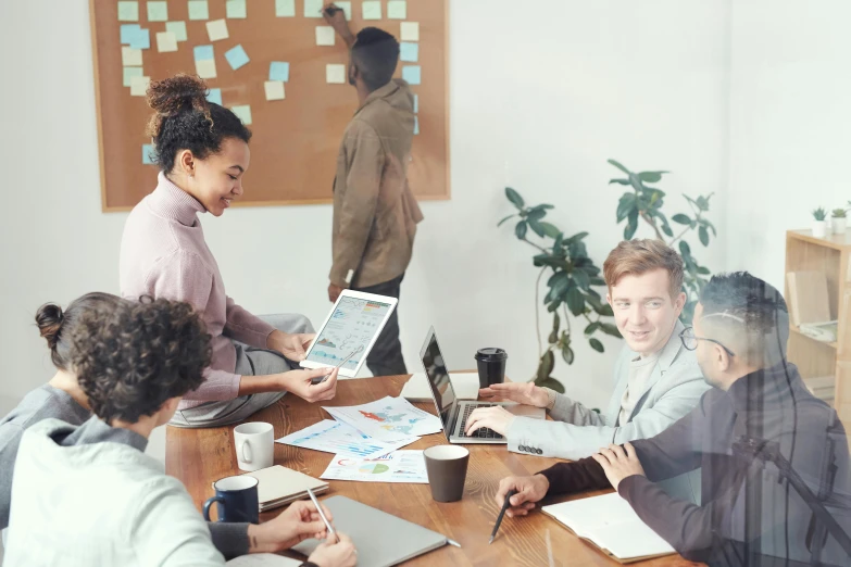 a group of people sitting around a wooden table, a cartoon, arbeitsrat für kunst, high-quality photo, whiteboards, ux, decoration