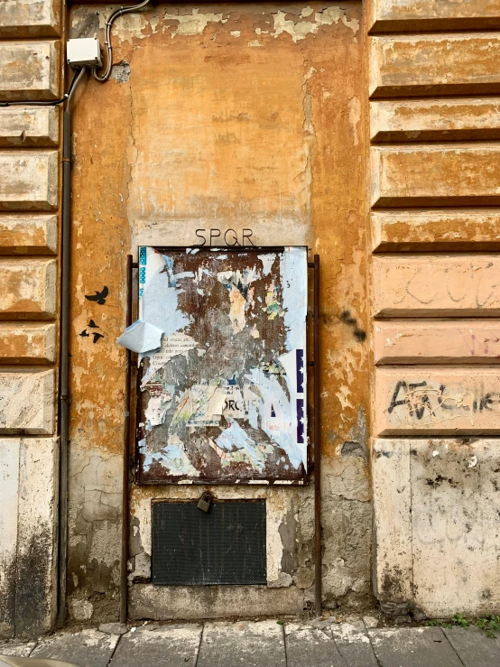 a door that is on the side of a building, by Cagnaccio di San Pietro, pexels contest winner, graffiti, a screenshot of a rusty, street printed poster, bleached colours, all roads lead to rome