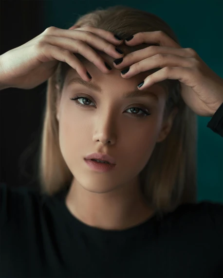 a woman with her hands on her head, inspired by Russell Dongjun Lu, trending on pexels, androgynous face, lalisa manobal, black eyeshadow, large friendly eyes
