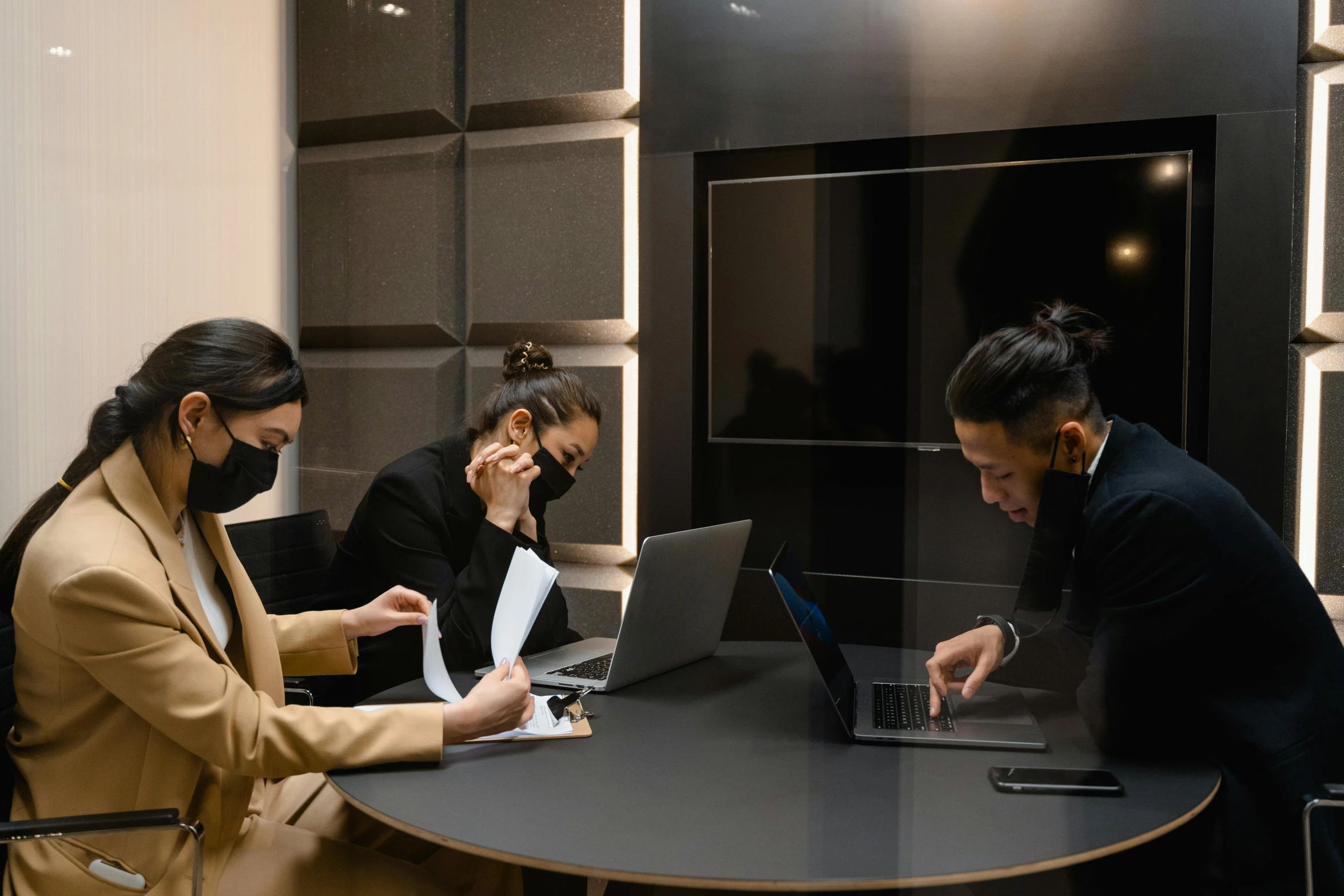 a group of people sitting around a table with laptops, by Emma Andijewska, pexels contest winner, people are wearing masks, ignant, cubical meeting room office, asian descend